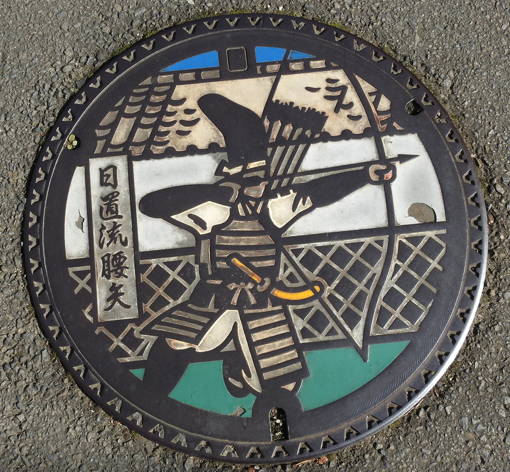 Japanese drain covers are an art form! Here a samurai archer in Izumi Bukeyashiki © Mark Brazil